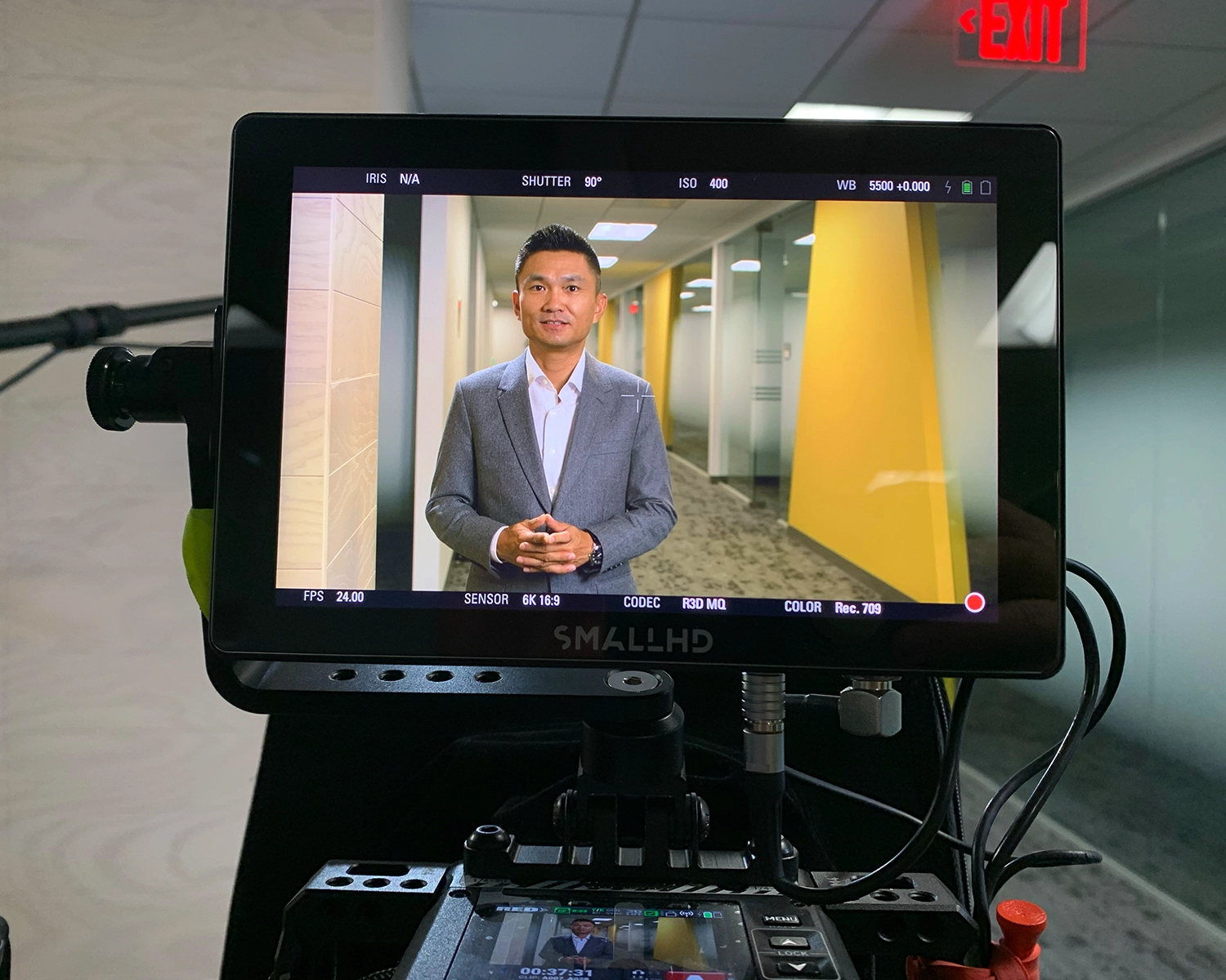 Corporate video production in office hallway